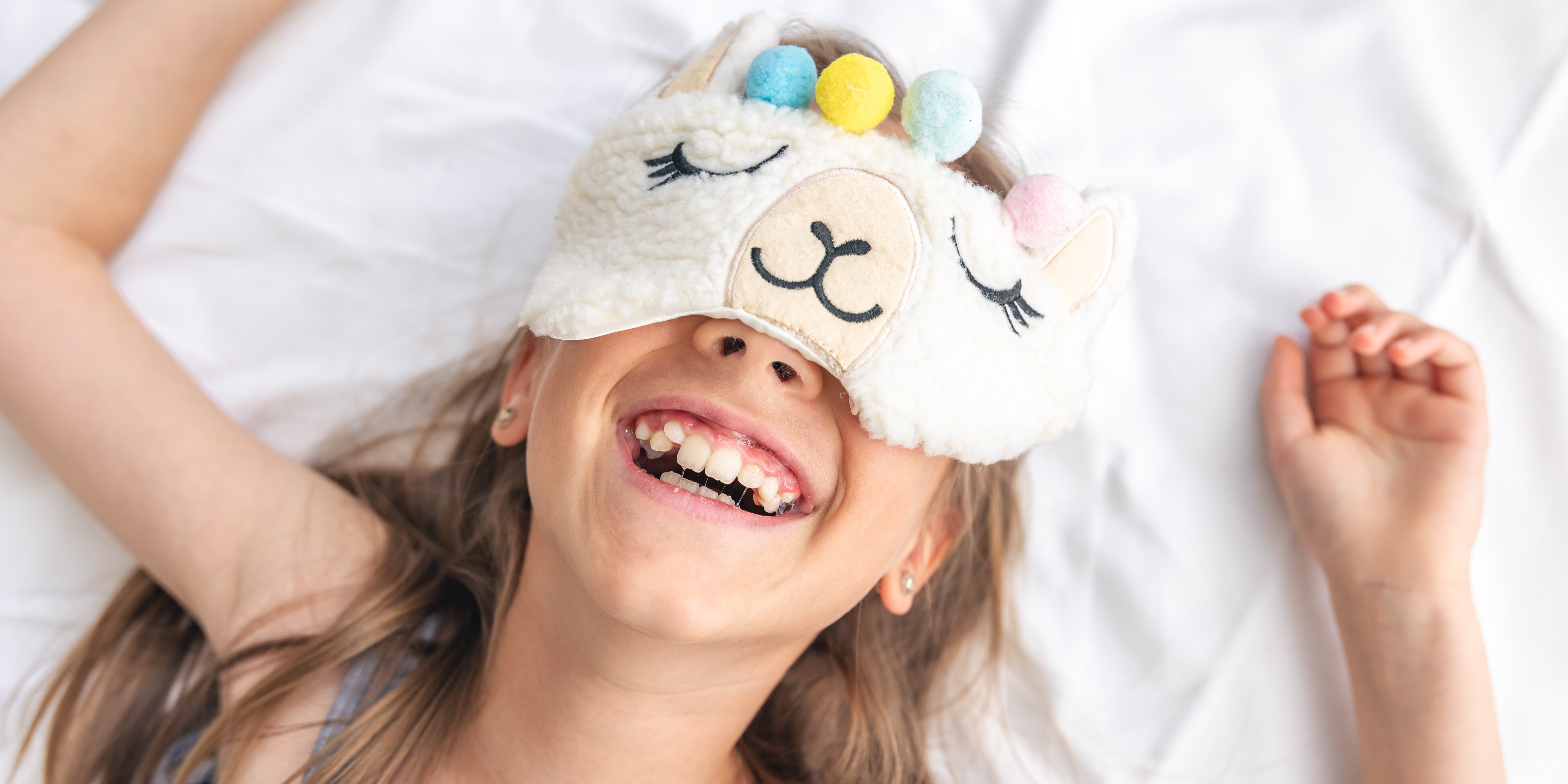 portrait-adorable-little-girl-walked-up-her-bed-sunny-morning