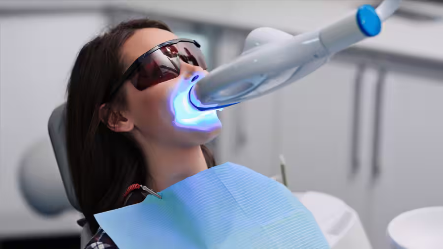 teeth-whitening-woman-bleaching-dentist-clinic